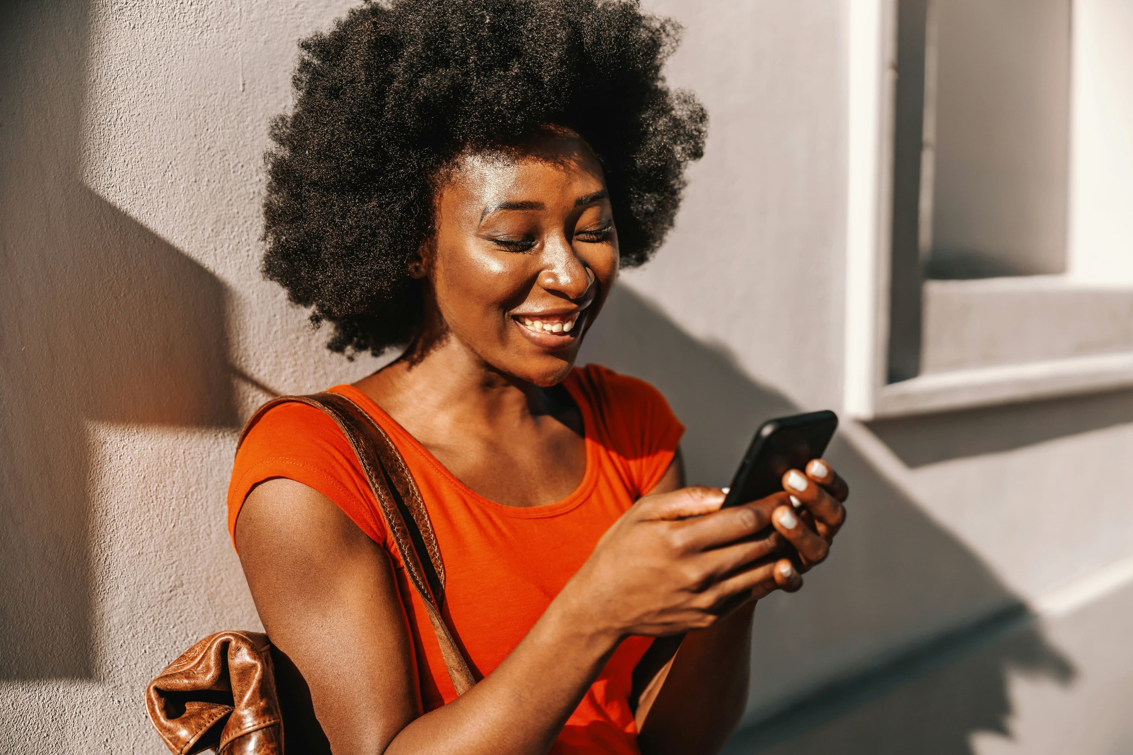 Seevcash community member using her phone